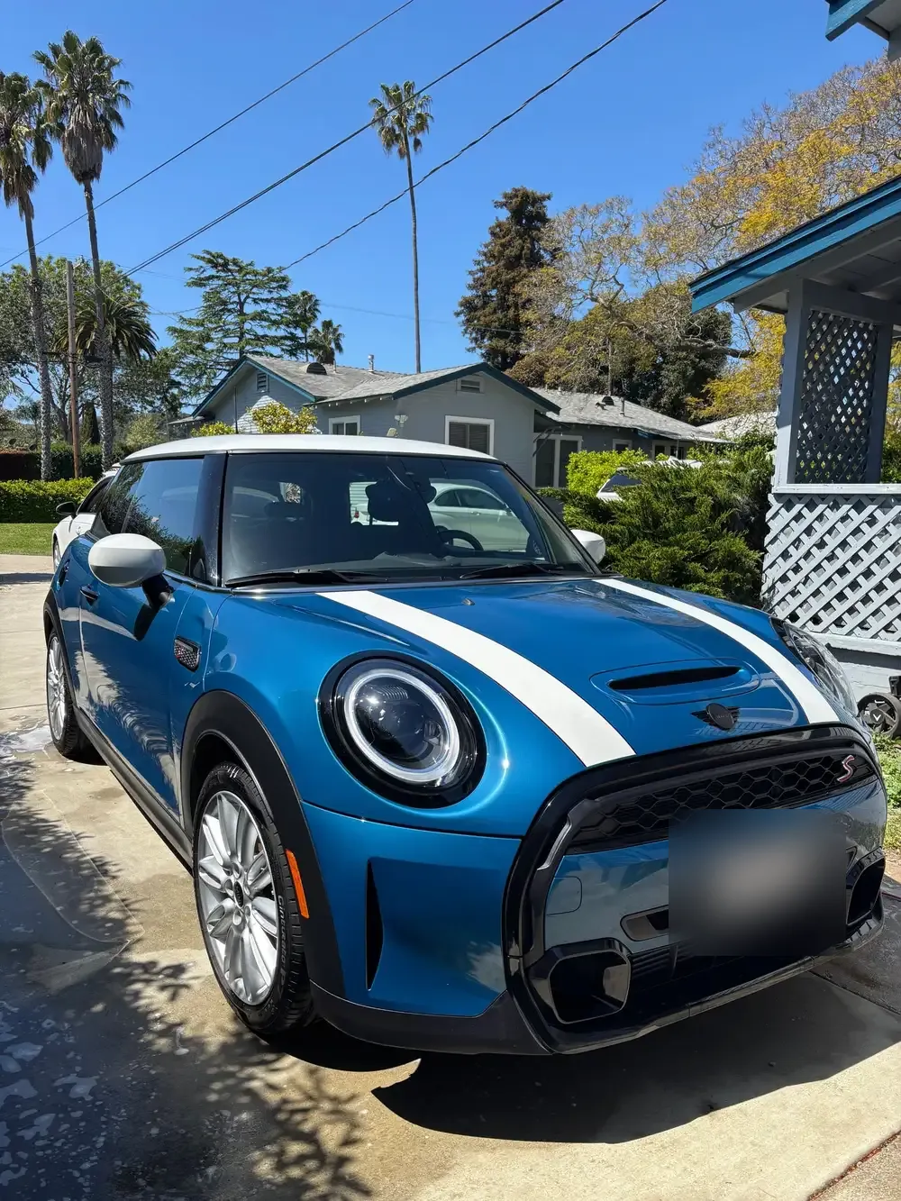Blue Mini Cooper with white stripes, washed